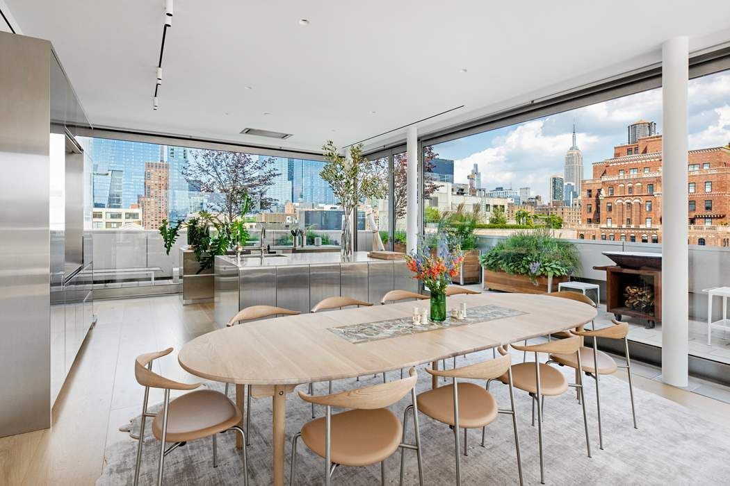 515 West 23rd Street, Unit PH Manhattan, NY 10011 - Photo 7 of 27 a dining room with furniture a floor to ceiling window and kitchen view