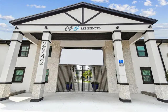 a view of a house with a backyard and a garden