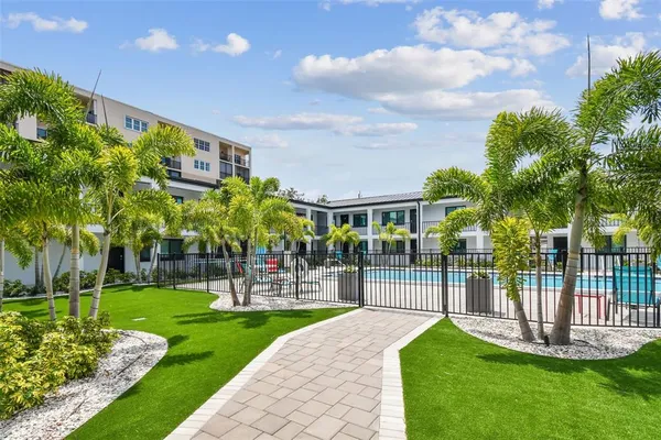 a view of swimming pool with outdoor seating