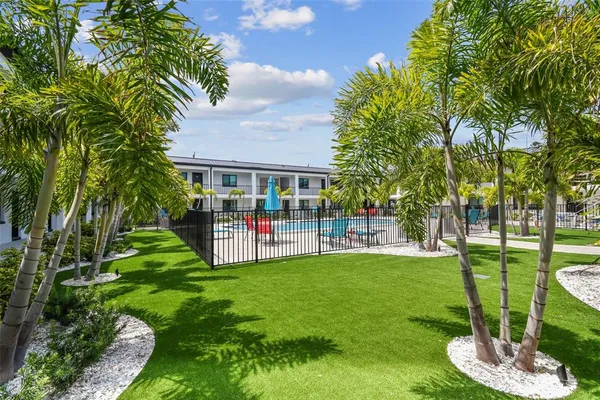 a view of swimming pool and outdoor seating