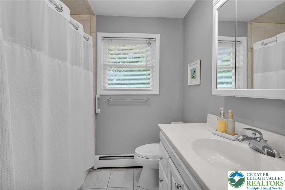 2750 Belaire Road Bethlehem, PA 18017 - Photo 33 of 56 Tiled flooring and a modern vanity define this functional bathroom layout.