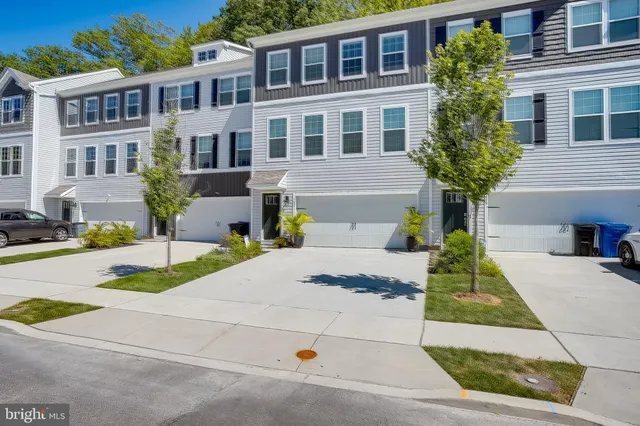 a front view of a house with yard
