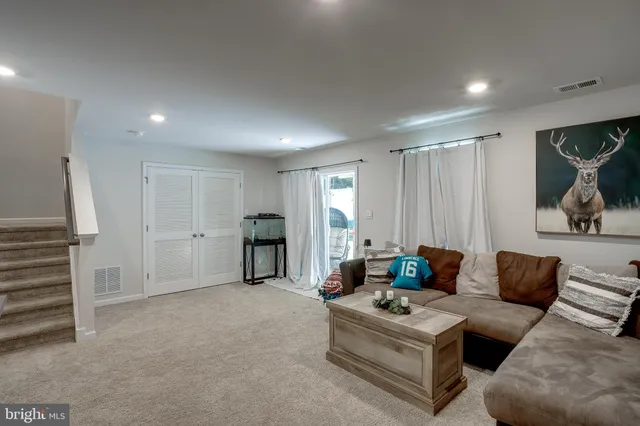 a living room with furniture and a couch