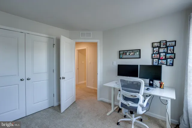 a view of a workspace with furniture