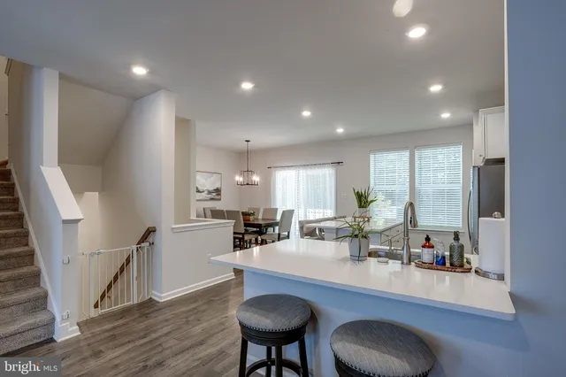 a view of kitchen dining table and chairs