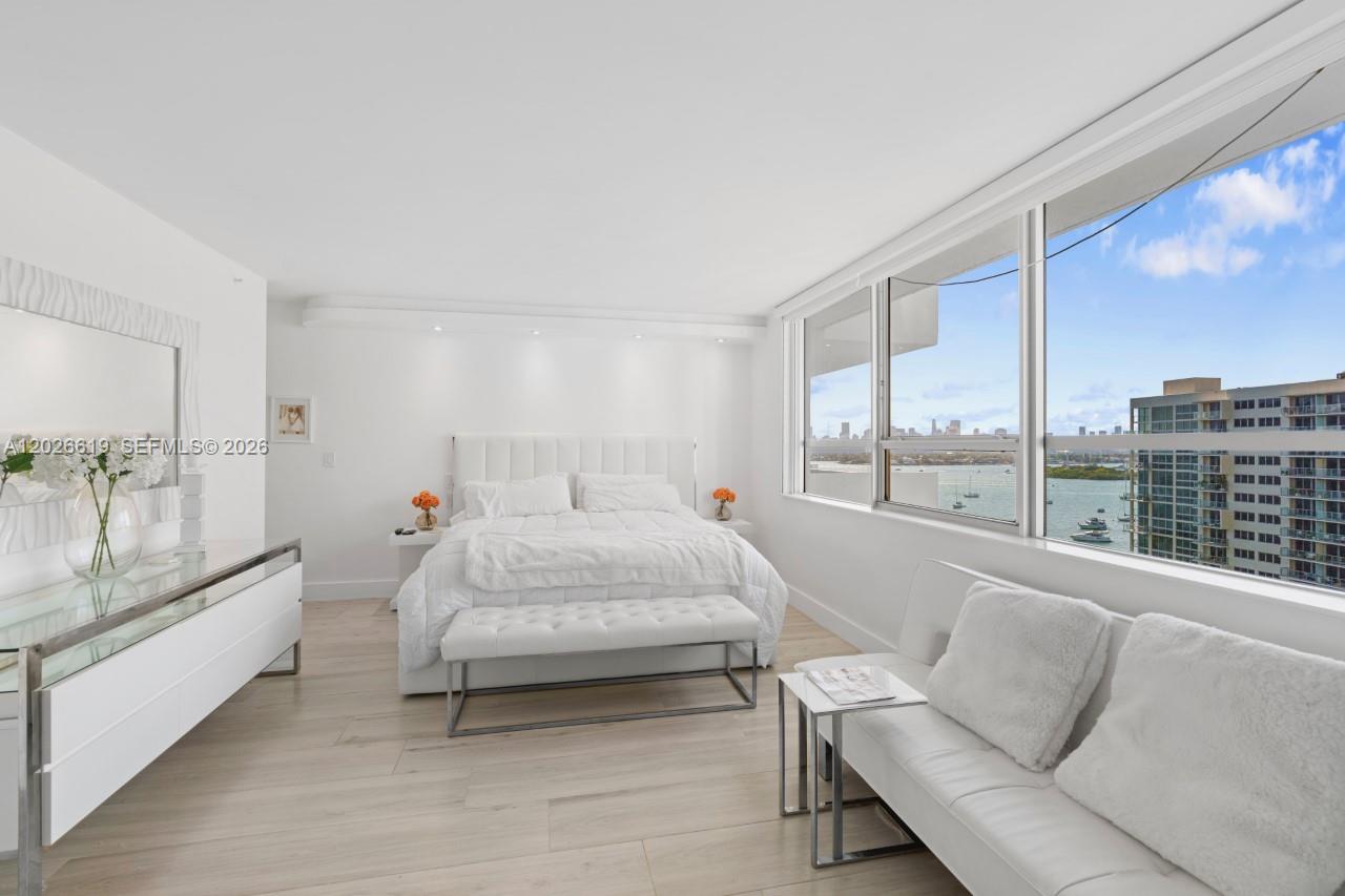 1500 Bay Road, Unit 1268S Miami Beach, FL 33139 - Photo 3 of 31 a bed room with a bed and a large window