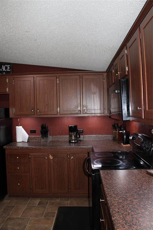 10780 County Road 3707 Wills Point, TX 75169 - Photo 20 of 34 a kitchen with a sink and cabinets