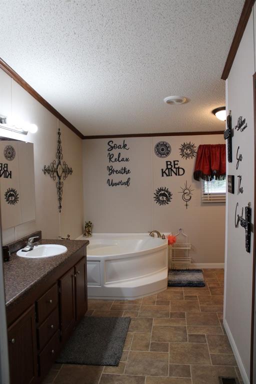 10780 County Road 3707 Wills Point, TX 75169 - Photo 24 of 34 a bathroom with a bathtub sink and toilet