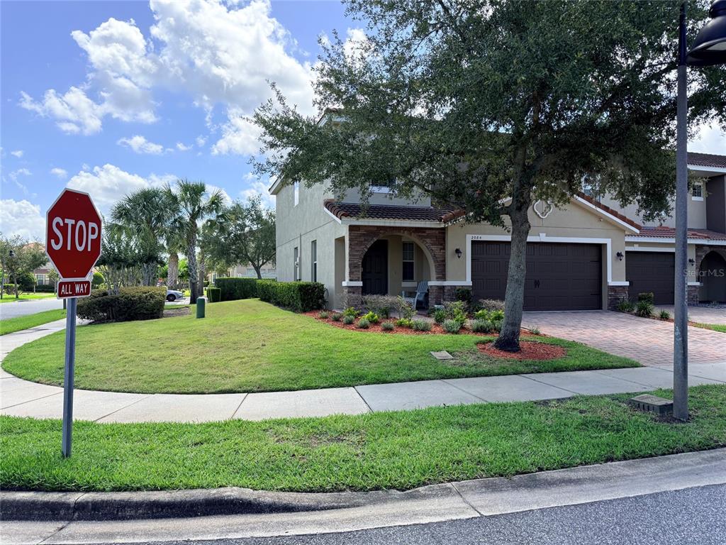 2084 Water Tupelo Way Ocoee, FL 34761 - Photo 25 of 34 a front view of a house with garden