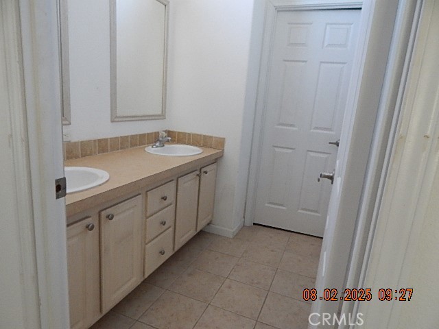 2905 Harden Avenue Corning, CA 96021 - Photo 24 of 26 a bathroom with a sink and a mirror