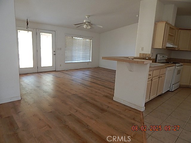 2905 Harden Avenue Corning, CA 96021 - Photo 25 of 26 a kitchen with stainless steel appliances granite countertop a sink cabinets and wooden floor
