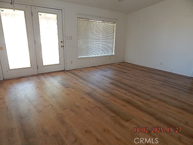2905 Harden Avenue Corning, CA 96021 - Photo 26 of 26 an empty room with wooden floor and windows