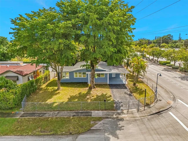 an aerial view of a house with a garden
