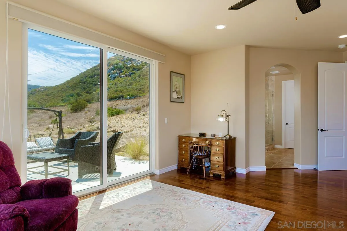 19840 7th Place Escondido, CA 92029 - Photo 26 of 49 a living room with furniture and a floor to ceiling window