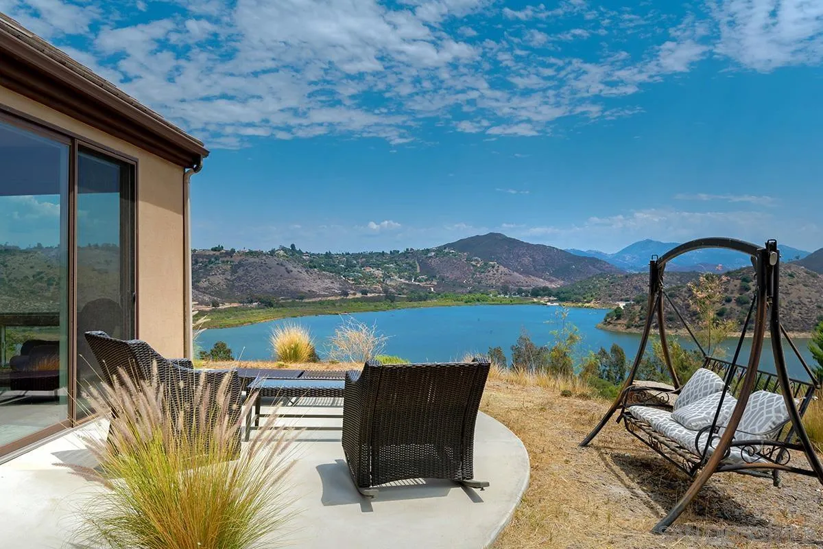 19840 7th Place Escondido, CA 92029 - Photo 28 of 49 a view of a lake with couches chairs and wooden floor