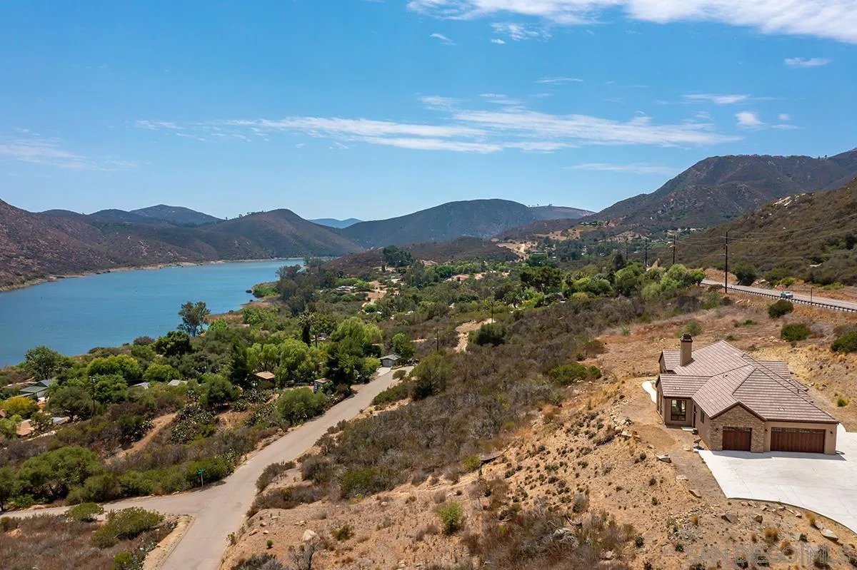 19840 7th Place Escondido, CA 92029 - Photo 3 of 49 a view of a lake with mountains in the background