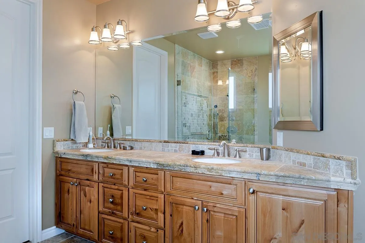 19840 7th Place Escondido, CA 92029 - Photo 32 of 49 a bathroom with double vanity and a mirror