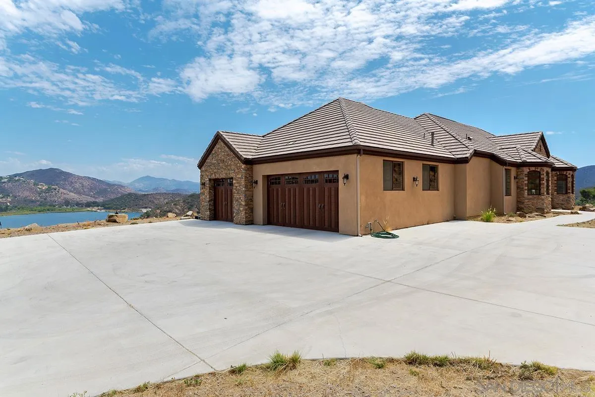 19840 7th Place Escondido, CA 92029 - Photo 42 of 49 a front view of a house with a yard and garage
