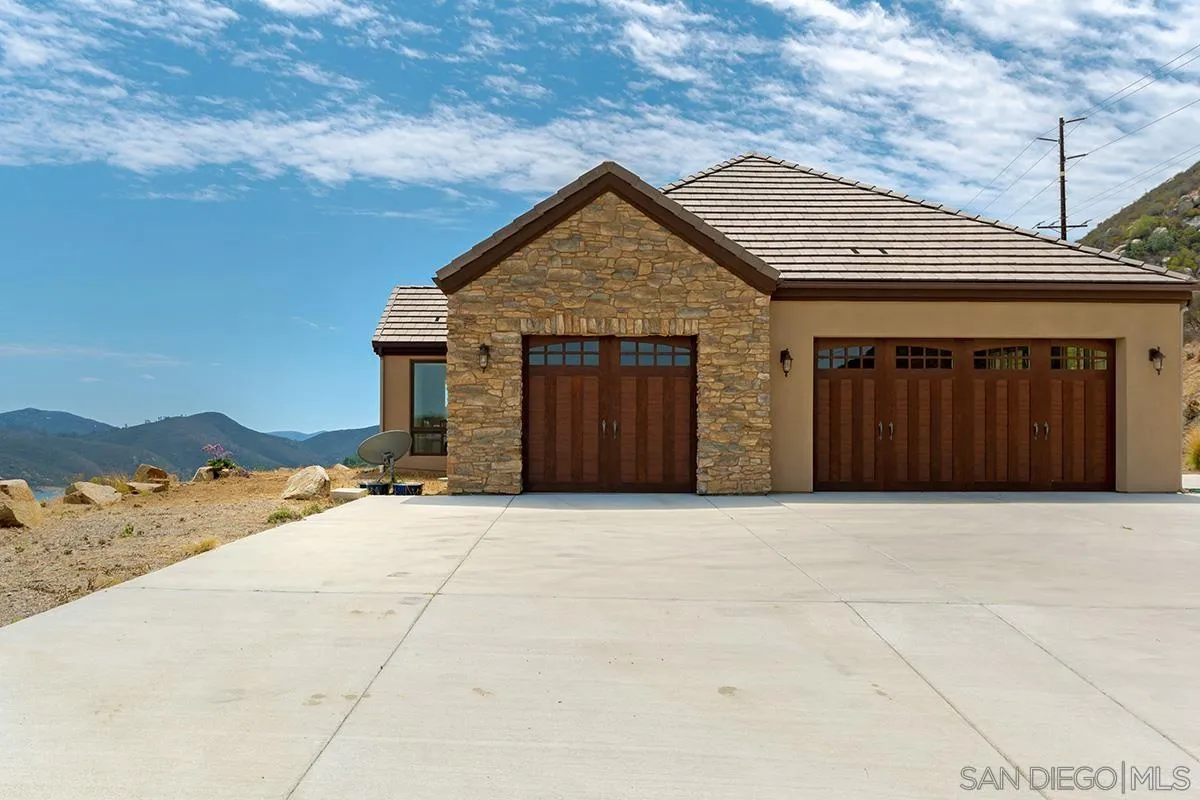 19840 7th Place Escondido, CA 92029 - Photo 43 of 49 a front view of a house with a yard and garage