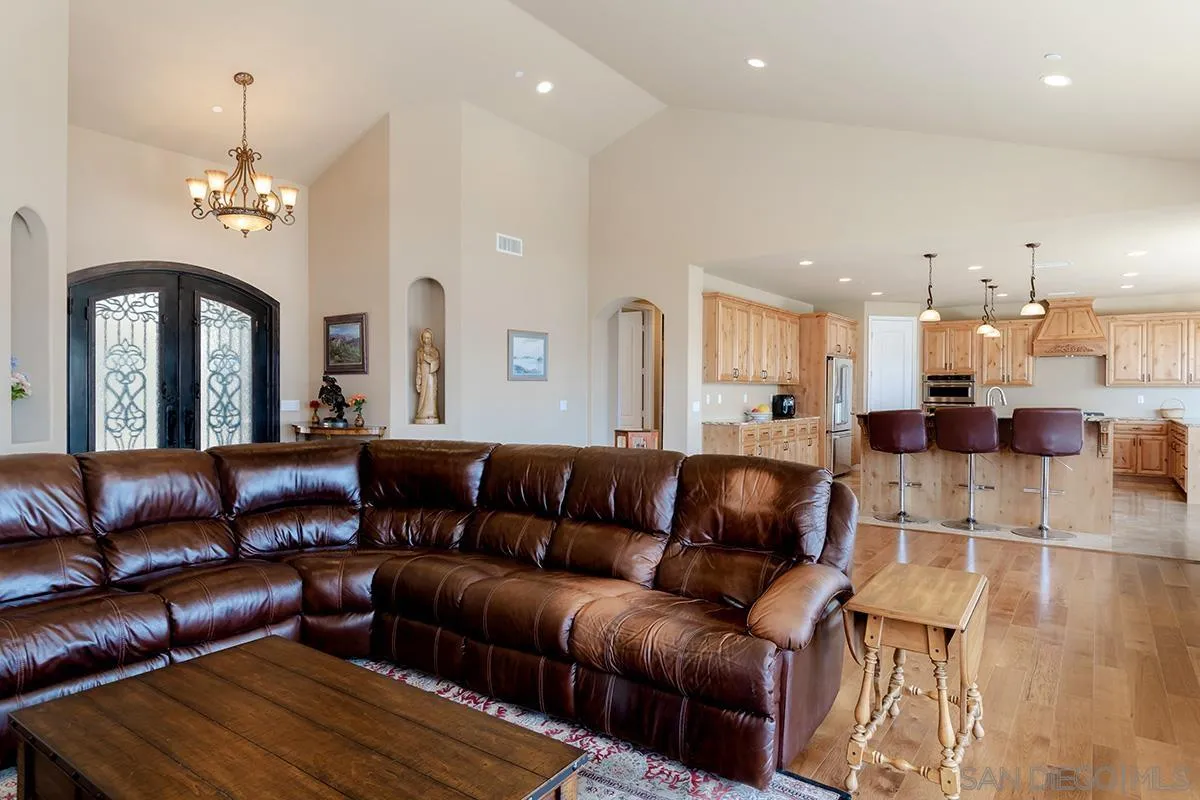 19840 7th Place Escondido, CA 92029 - Photo 7 of 49 a living room with furniture and a chandelier