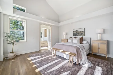 a dining room with a large window and couch