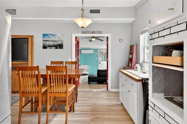 a kitchen with stainless steel appliances granite countertop a stove and a refrigerator