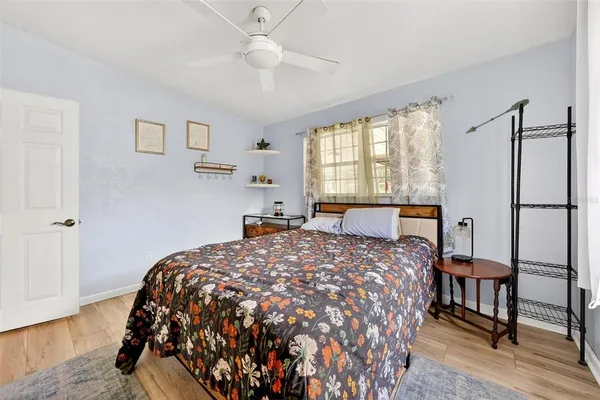 a bedroom with bed and window