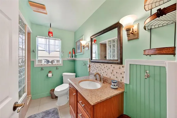 a bathroom with a sink and mirror