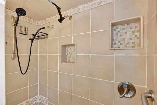 a bedroom with furniture and a wooden floor