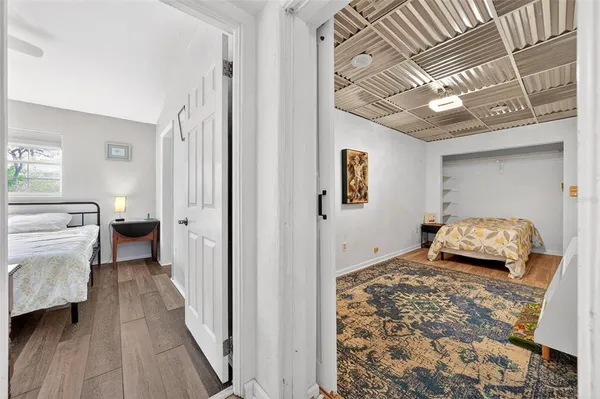 a bedroom with bed and window