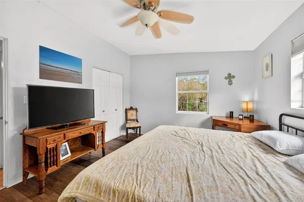 a bedroom with a bed and a table in it