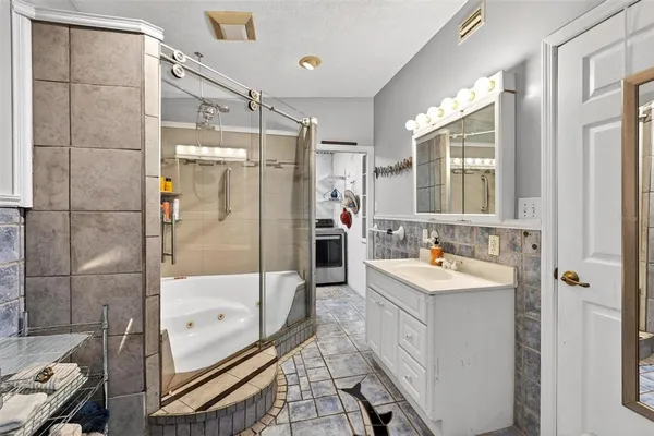 a bathroom with a bathtub and shower