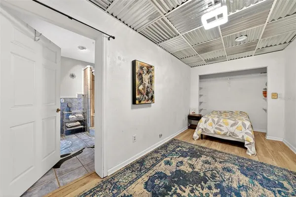 a bedroom with furniture and a window