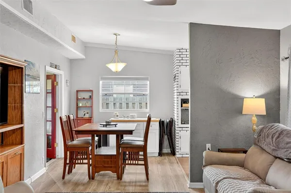 a view of a dining room with furniture window and wooden floor