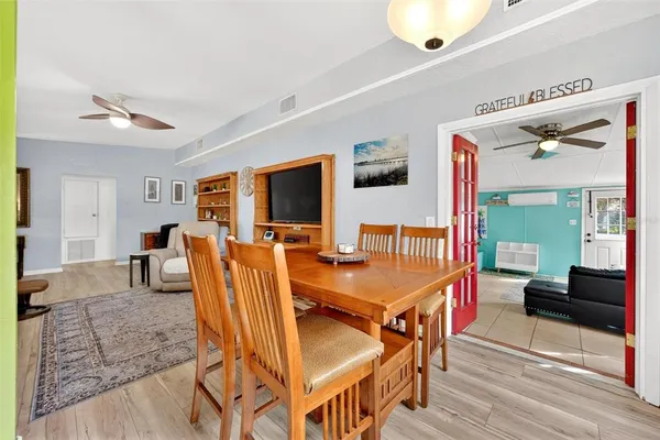 a view of dining room and wooden floor
