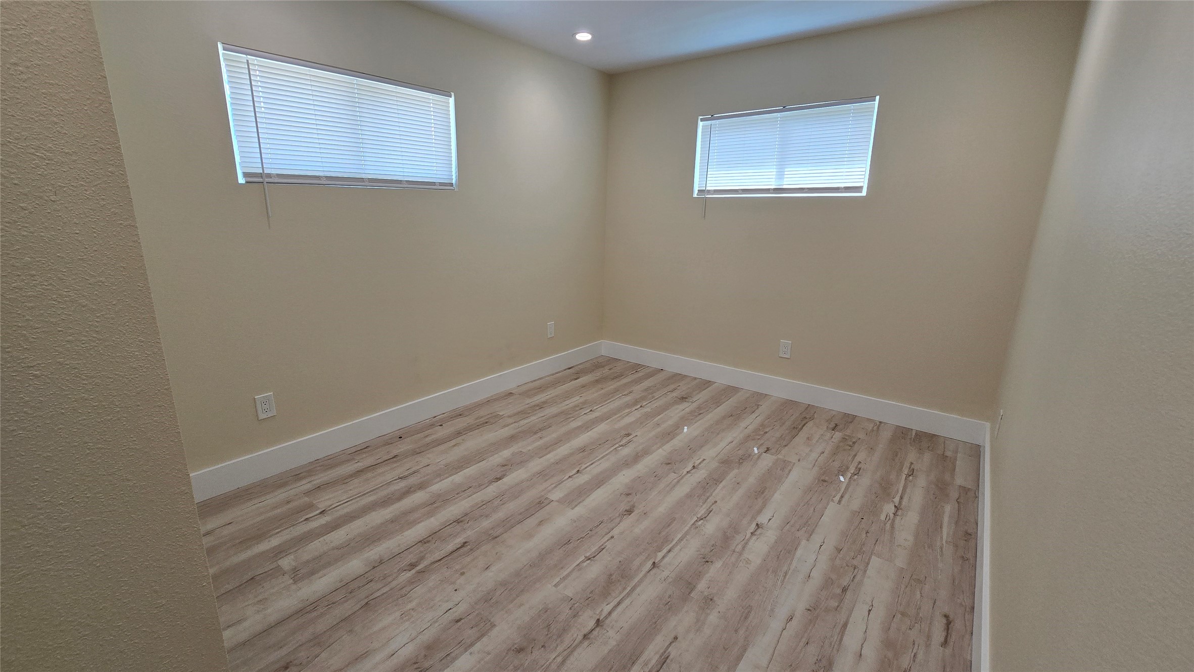 3741 Seabrook Street Houston, TX 77021 - Photo 13 of 50 a view of room with wooden floor and fan