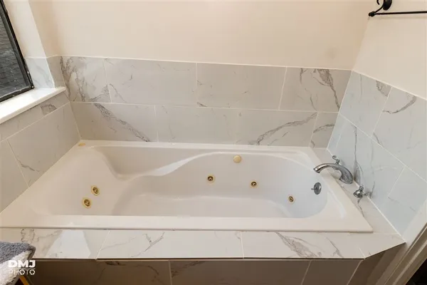 a bathroom with a bathtub