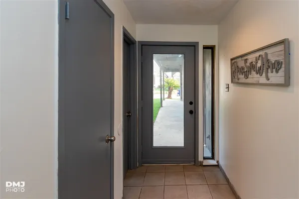 a view of an entrance and a hallway