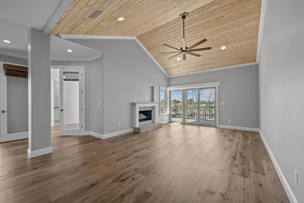 a view of an entryway with wooden floor
