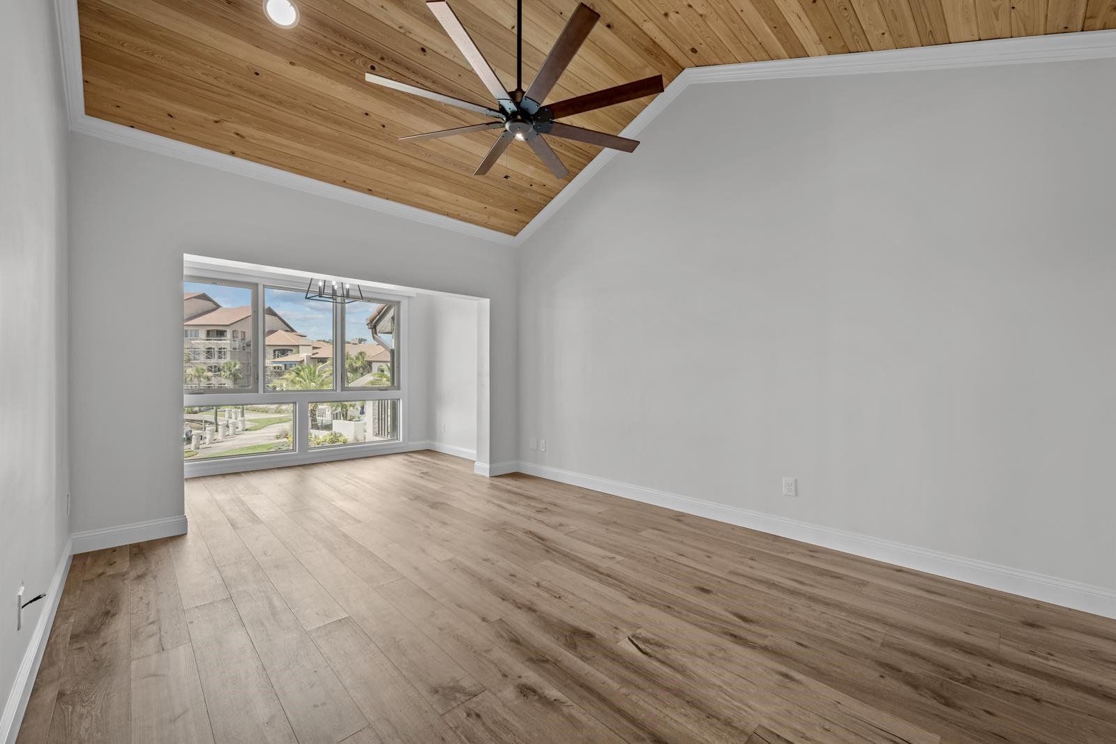 3505 Harbor Drive St. Augustine, FL 32084 - Photo 26 of 55 a view of an empty room with a window and wooden floor