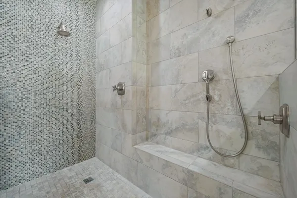 a view of empty room with wooden floor and window