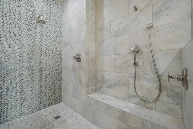a view of empty room with wooden floor and window