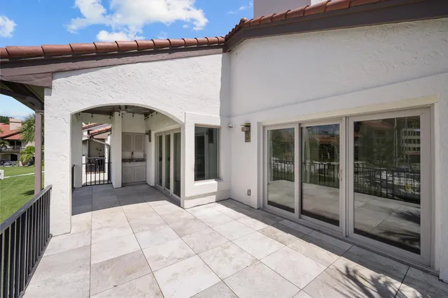 a very nice looking room with a large window and chandelier