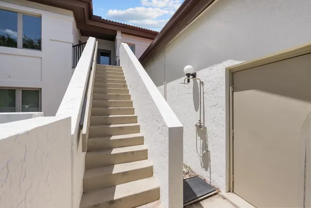 an aerial view of a house with a lake view