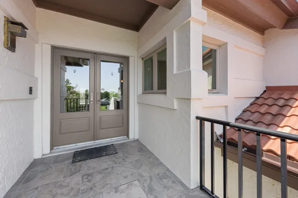 a view of a kitchen with a sink and wooden floor