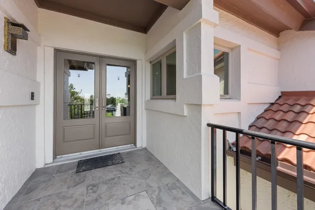 a view of a kitchen with a sink and wooden floor