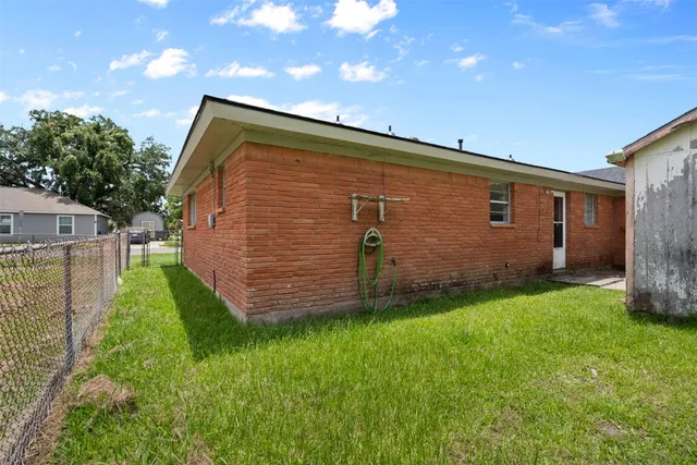 a backyard of a house with lots of green space