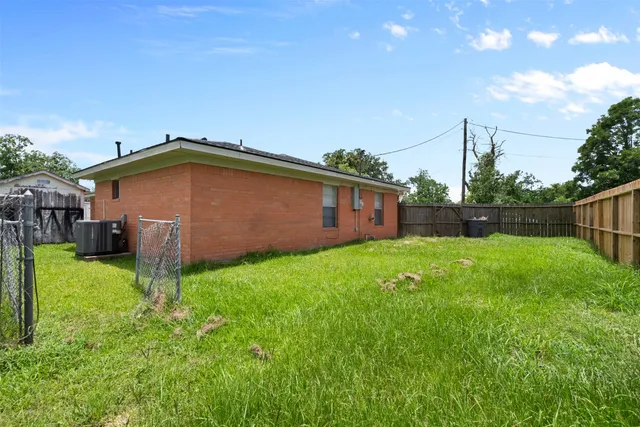 a backyard of a house with lots of green space