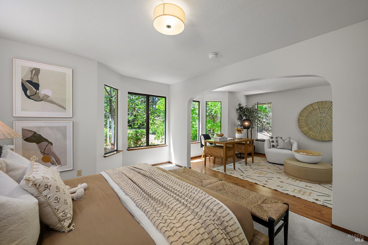 7595 Giusti Road Forestville, CA 95436 - Photo 23 of 41 a bedroom with a bed and a large window
