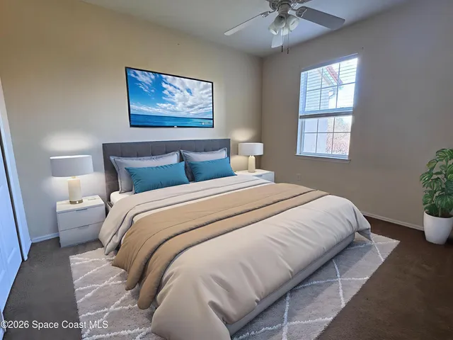 a bedroom with bed and window